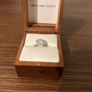 Size 6 diamond halo ring with 7mm moissanite center stone. 18k white gold band.